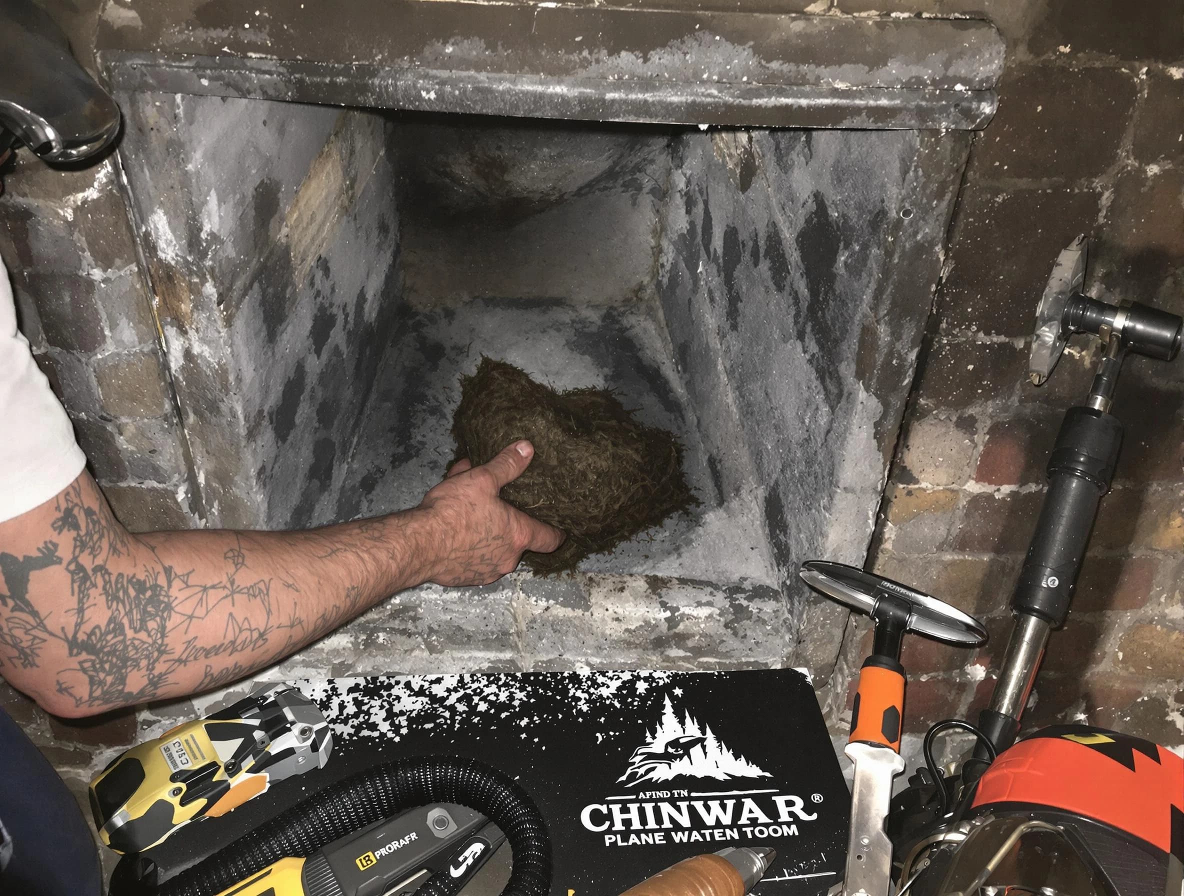 Wall Chimney Sweep safely removing debris and screening chimney in Wall, NJ